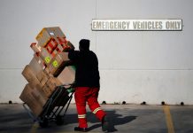 A worker delivers boxes to Southgate shopping mall, south of Johannesburg
