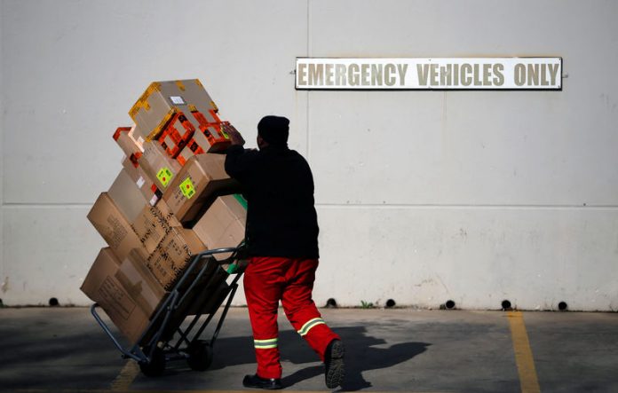 A worker delivers boxes to Southgate shopping mall, south of Johannesburg A worker delivers boxes to Southgate shopping mall, south of Johannesburg