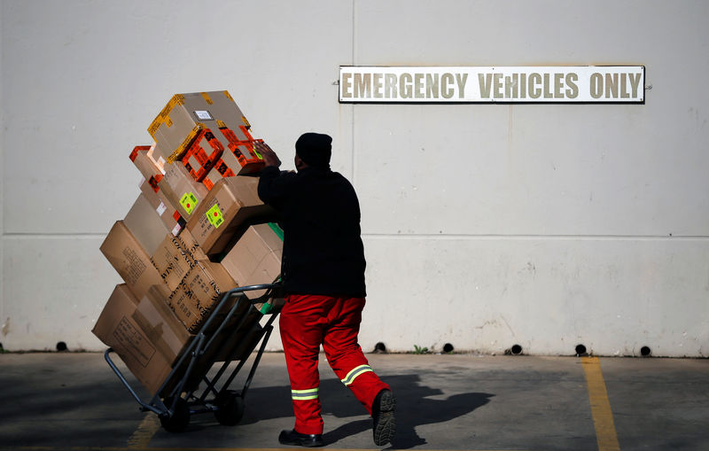 A worker delivers boxes to Southgate shopping mall, south of Johannesburg