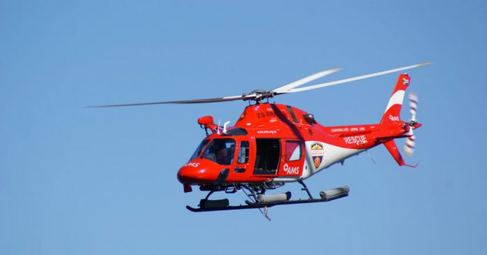 rescue helicopter searching for crayfish diver at betty's bay