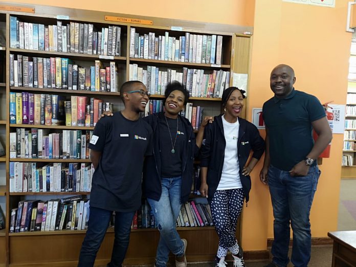 elearning manager on Green Tshirt at Sandringham library with Elearning Champions Librarians after an elearning marathon program city of joburg libraries up for international award