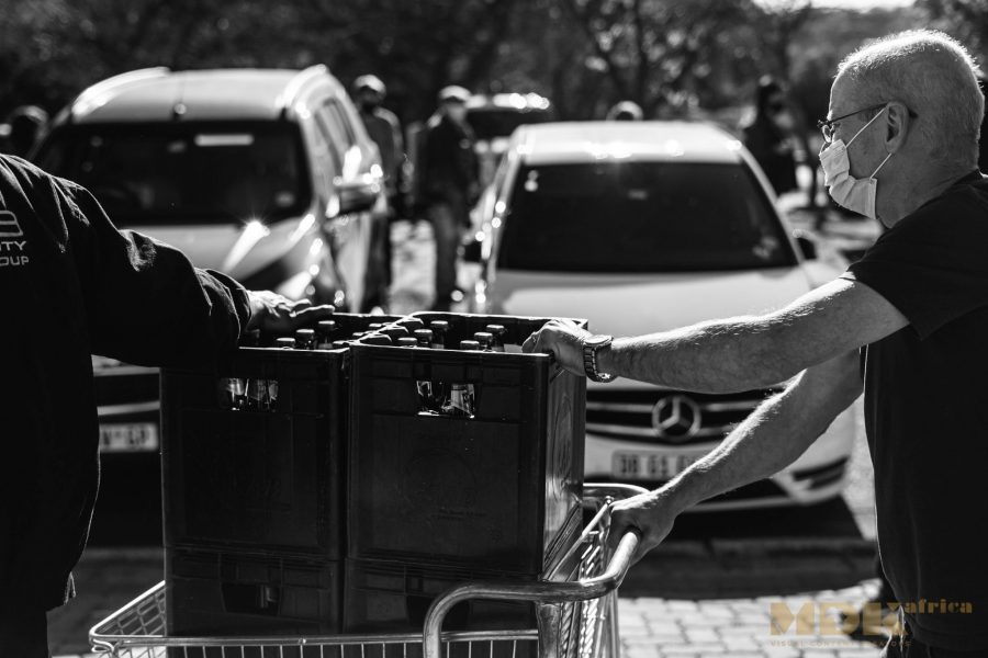 south africans queue alcohol bottle stores