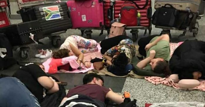 south-africans-sleeping-airport-china south-africans-sleeping-airport-china