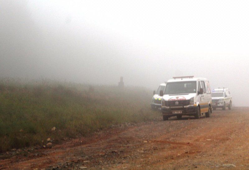 The first rescuers in a snap taken by an ambulanceman shows the thick cloud that enveloped the Cessna as it flew into trees in a nearby forest