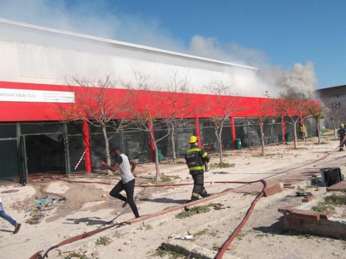 mob burns covid facility cape town The Desmond Tutu Community Hall in Khayelitsha was gutted on Saturday during a protest allegedly by a group occupying vacant land in Makhaza. Photo: Vincent Lali