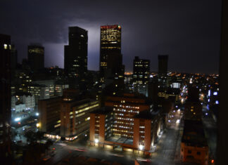 Johannesburg city skyline at night during thunderstorm and lightning