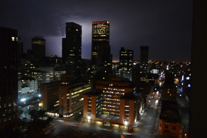 Johannesburg city skyline at night during thunderstorm and lightning