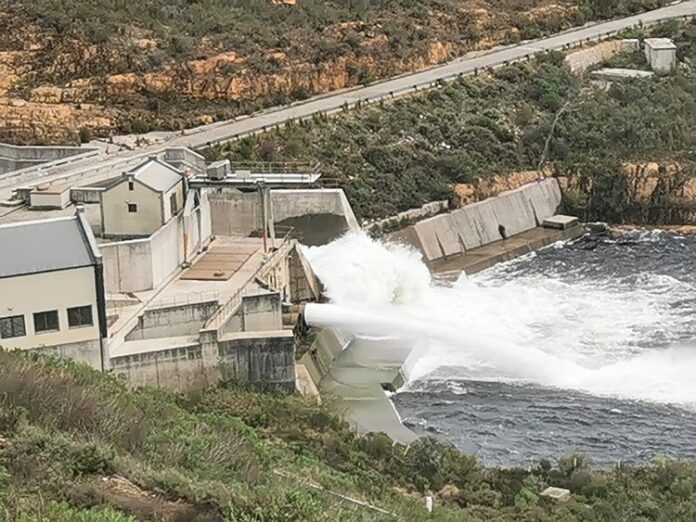 The Berg River Dam, which can hold 14% of Cape Town’s water capacity, is full, so the sluice has been opened. Photo: Nathan Geffen