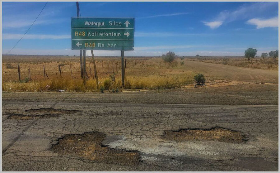 Keith Garnet Millar photos small town south africa potholes road sign