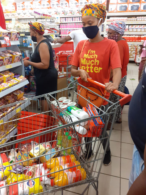 Keneiloe Serongoane from Edenvale, who is a bottle top collector and member of bahapi ba baruhi getting food parcels for 3 families in Thokoza AND Vosloorus