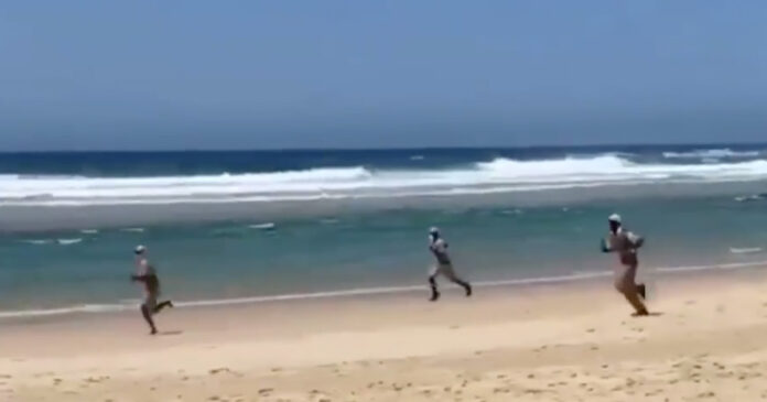 cops-chase-surfer-beach-south-africa