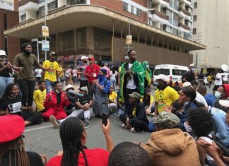 Wits SRC President Mpendulo Mfeka addressing students as they waited for the police spokesperson to address them. The spokesperson did not address students. Photos: Masego Mafata