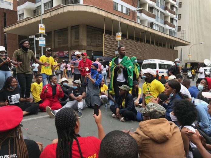 Wits SRC President Mpendulo Mfeka addressing students as they waited for the police spokesperson to address them. The spokesperson did not address students. Photos: Masego Mafata Wits SRC President Mpendulo Mfeka addressing students as they waited for the police spokesperson to address them. The spokesperson did not address students. Photos: Masego Mafata
