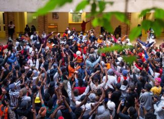 Over 150 UCT students protested in the Kramer Law Building on Friday against the financial exclusion of those who are unable to pay fees or who have historic debt. Photo: Ashraf Hendricks