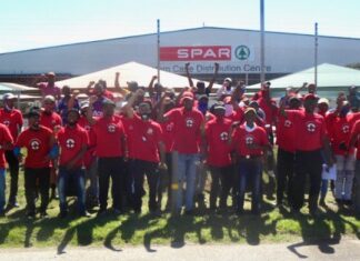 Striking workers gathered outside the Spar distribution centre in Perseverance, Gqeberha. The strike came after workers rejected the company’s offer of a 3% pay increase. Photo: Joseph Chirume