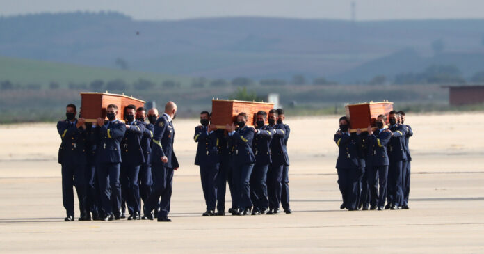 Rory-Young-wildlife-conservationist-killed-2021-04-30T092026Z_1_LYNXMPEH3T0H0-OZATP_RTROPTP_4_OZATP-UK-BURKINA-SECURITY-EUROPE Spanish Air Force personnel carry coffins of two Spanish journalists and an Irish citizen who were killed in an armed ambush on an anti-poaching patrol in Burkina Faso, at the military airbase in Torrejon de Ardoz, Spain, April 30, 2021. REUTER/Sergio Perez