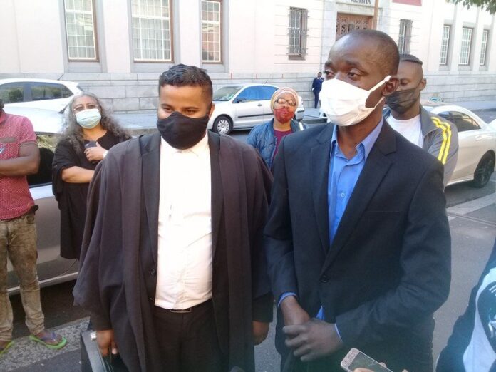 suspect fire cape town Lawyer Shaun Balram with his client Frederick Mhangazo at the Cape Town Magistrates’ Court on Wednesday. Photo: Marecia Damons