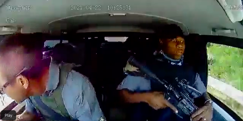 Driver Leo Prinsloo orders his driver to cock his automatic rifle