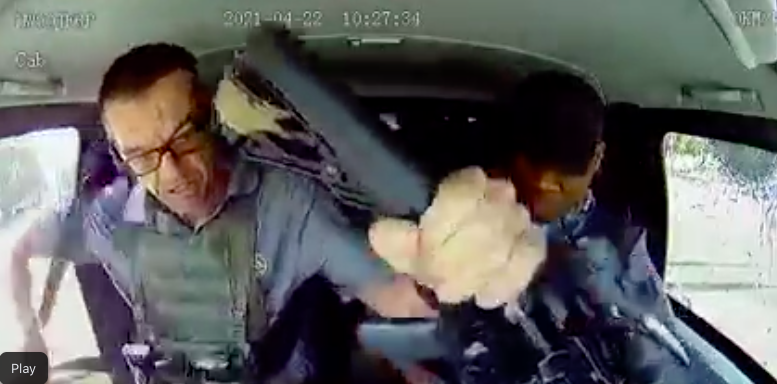 Fed up of being shot at Leo Prinsloo stops his Land Cruiser and grabs his automatic rifle from the guard who has cocked it