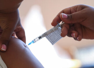 A healthcare worker receives the Johnson and Johnson coronavirus disease (COVID-19) vaccination at Khayelitsha Hospital near Cape Town. REUTERS/Mike Hutchings