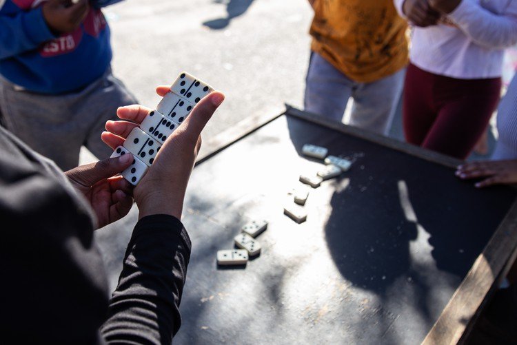 Kalib Missoe runs an after school dominoes club in Belhar, Cape Town