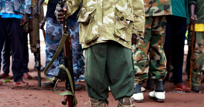 child-kidnappings-mozambique-2021-06-CHILD-SOLDIERS A former child soldier holds a gun as they participate in a child soldiers' release ceremony, outside Yambio, South Sudan, August 7, 2018. REUTERS/Andreea Campeanu