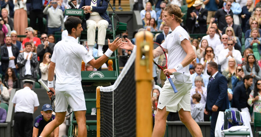 Tennis - Wimbledon - All England Lawn Tennis and Croquet Club, London, Britain - June 30, 2021 Serbia'a Novak Djokovic shakes hands with South Africa's Kevin Anderson after winning their first round match REUTERS/Toby Melville