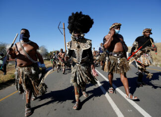 Supporters of former South African President Jacob Zuma walk to his home in Nkandla