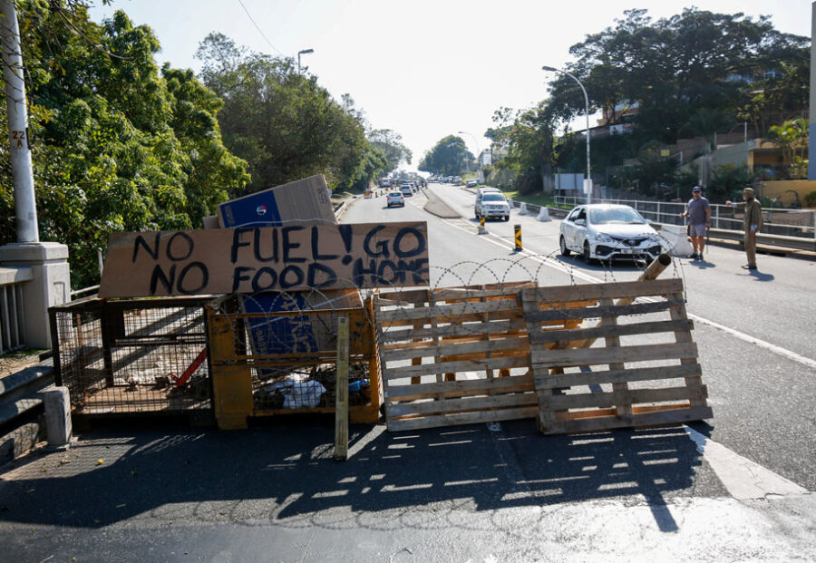 FILE PHOTO: Community members monitor access to a suburb after several days of looting following the imprisonment of former South Africa President Jacob Zuma, in Durban, South Africa, July 15, 2021. REUTERS/Rogan Ward
