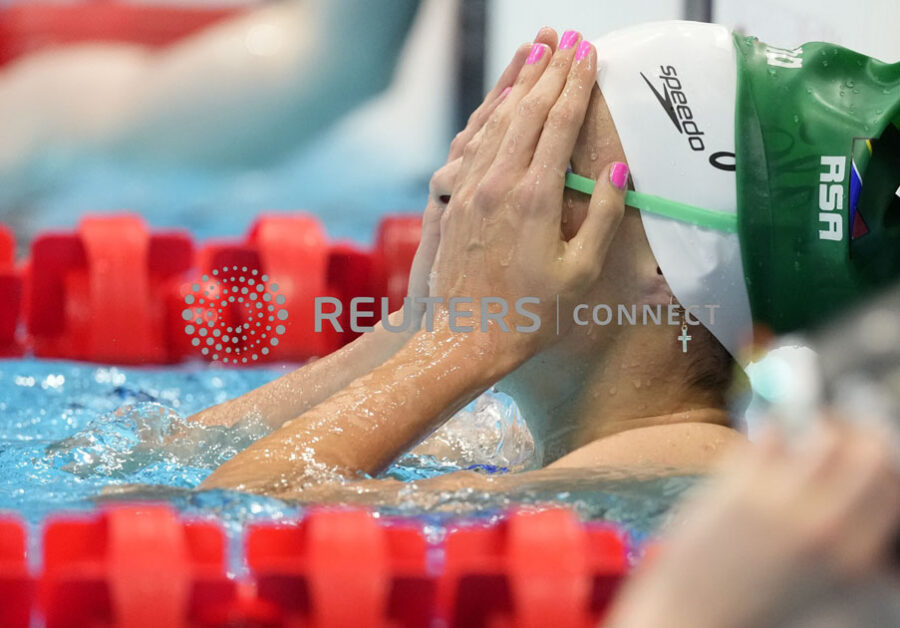 Tokyo 2020 Olympics - Swimming - Women's 100m Breaststroke - Heats - Tokyo Aquatics Centre - Tokyo, Japan - July 25, 2021. Tatjana Schoenmaker of South Africa reacts after setting Olympic record. REUTERS/Aleksandra Szmigiel Tokyo 2020 Olympics - Swimming - Women's 100m Breaststroke - Heats - Tokyo Aquatics Centre - Tokyo, Japan - July 25, 2021. Tatjana Schoenmaker of South Africa reacts after setting Olympic record. REUTERS/Aleksandra Szmigiel