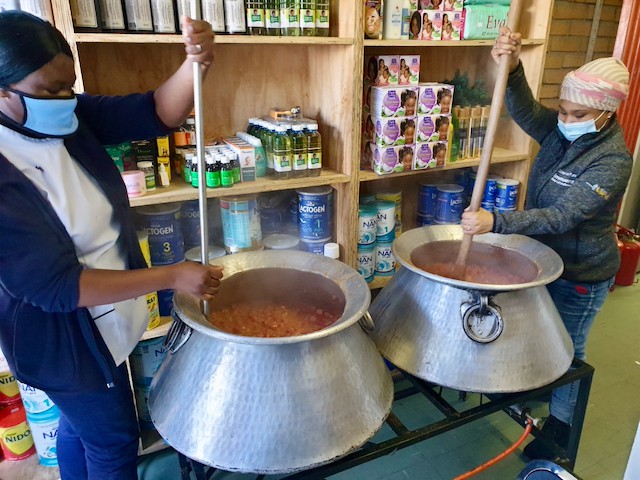 pharmacist feed hundreds gup Marshay Jantjies and Bianca Dumba prepare to serve the hot dish to nearly 700 people outside the pharmacy on Thursday morning.