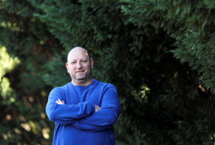 Cape Town restaurateur Adrian Hochman poses for a picture outside his home in Cape Town Wealthy top earners leave South Africa