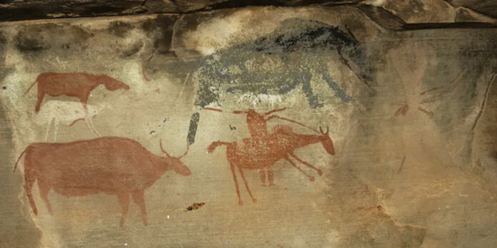 rock-art-south-africa-thecon Painting of a raider on horseback (bottom right) with a musket and domestic stock. A ‘rain-animal’ (top right) was likely summoned to wash away the raiders’ tracks. Courtesy of Sam Challis and Brent Sinclair-Thomson