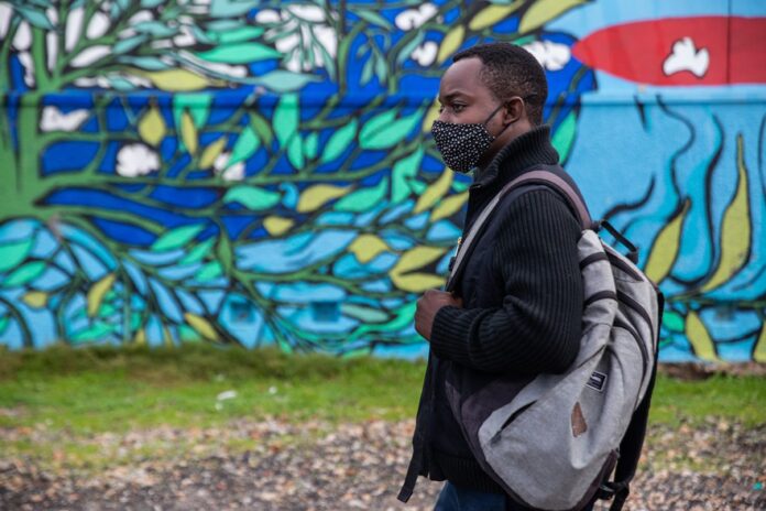 walter_nyamugama-Story teller GUP When the Covid-19 pandemic hit South Africa last year, Walter Nyamugama, pictured here in Muizenberg in August 2021, soon found himself living in a tent in a park with other homeless people. Photo: Ashraf Hendricks