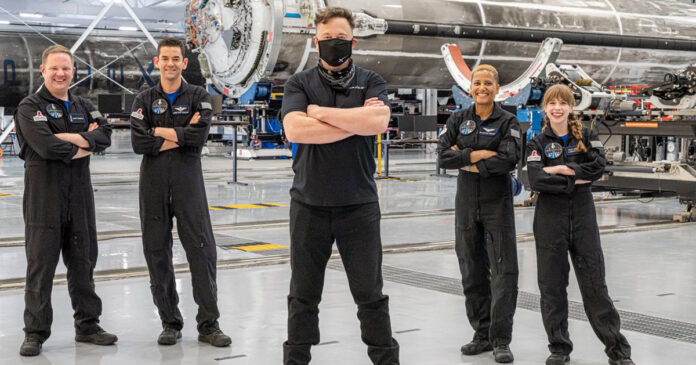 Elon-Musk-space-tourists-th Elon Musk with the four 'space tourists'. Photo: Inspiration4 Mission