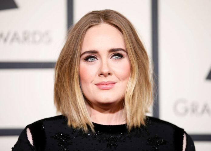 FILE PHOTO: Adele arrives at the 58th Grammy Awards in Los Angeles Adele breaking records Easy On Me