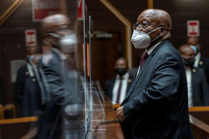 Former South African President Jacob Zuma waits in court during his corruption trial in Pietermaritzburg
