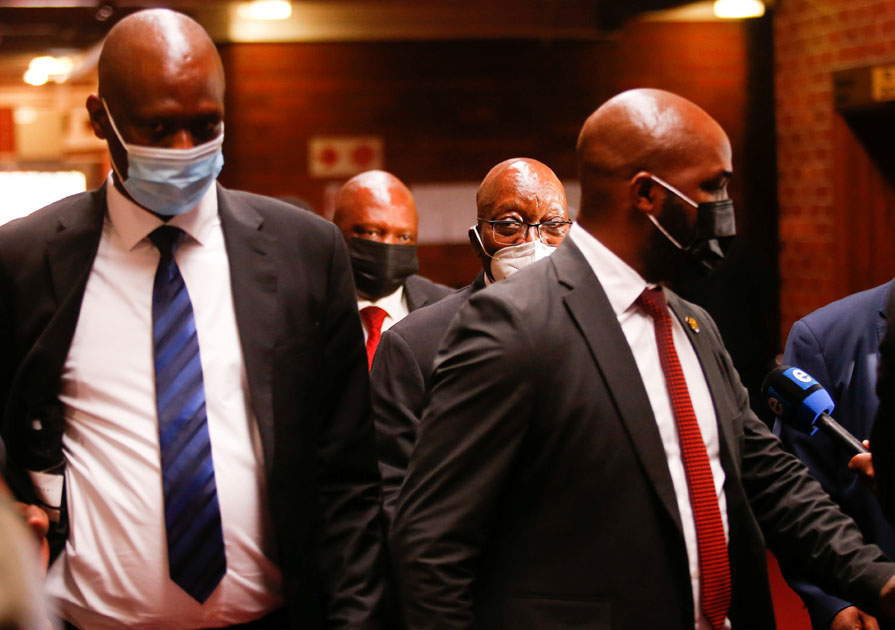 South Africa's former president Jacob Zuma walks with his daughter Duduzile Zuma-Sambdula after appearing in the High Court in Pietermaritzburg