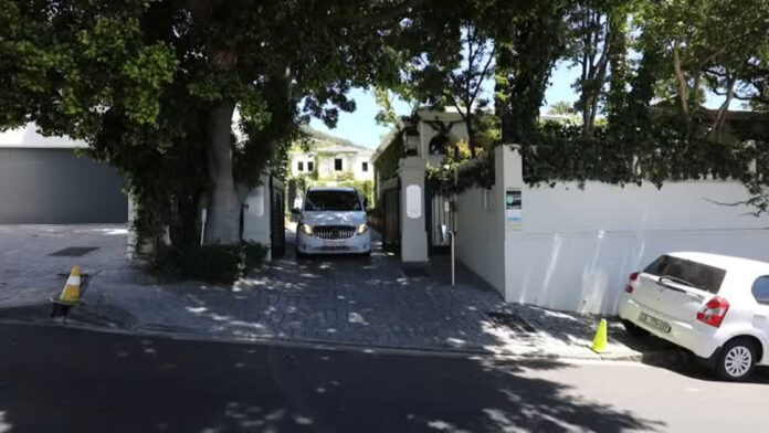 A hearse carries the body of FW de Klerk from his home in Cape Town earlier today. Photo: Reuters video keyframe
