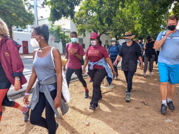 Stellenbosch University walk student loan About 50 Stellenbosch University students, staff and alumni joined a 16km Social Justice Walk through Stellenbosch at the weekend to raise funds to help pay off student debt. Photo: Marecia Damons