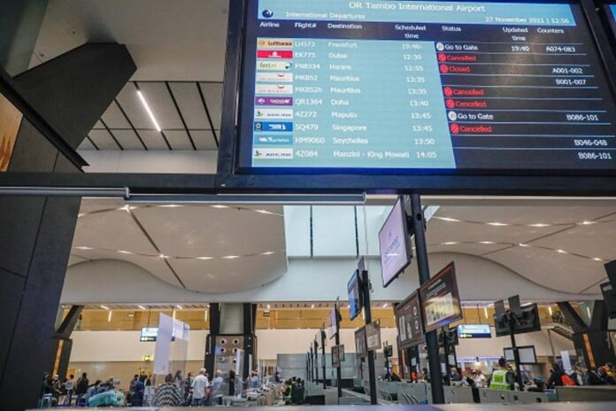 omicron what to know What not to do: ban travel. Scenes at South Africa’s OR Tambo International airport after the first flight bans were announced. Phill Magakoe / AFP via Getty Images