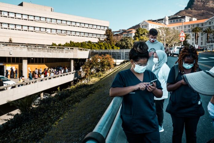 vaccine shots teenagers south africa thecon People queuing to get vaccinated. Instead of vaccinating 12-17 year olds, government should focus on giving boosters to people who need it. Shutterstock