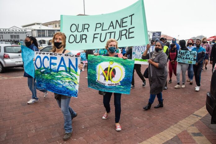 shell protest Protesters in Muizenberg, Cape Town call for Shell’s seismic survey on the Wild Coast to be stopped. Photo: Ashraf Hendricks
