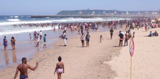Revellers enjoy New Year's Day on a beach, in Durban