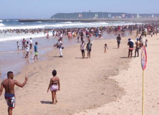 Revellers enjoy New Year's Day on a beach, in Durban