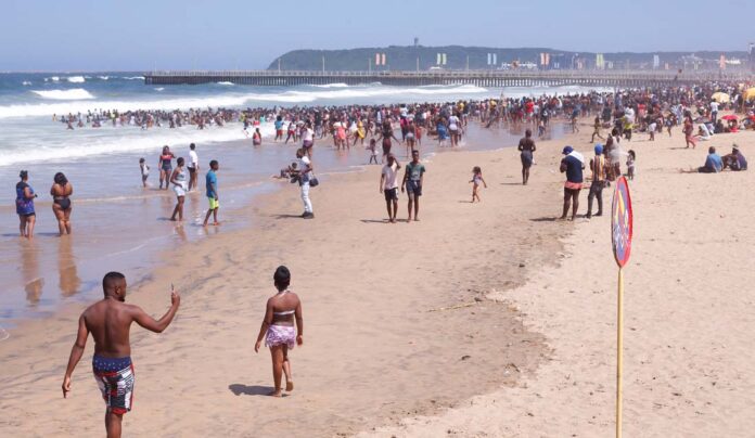 Revellers enjoy New Year's Day on a beach, in Durban Revellers enjoy New Year's Day on a beach, in Durban