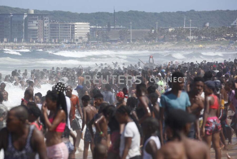 Revellers enjoy New Year's Day on a beach, in Durban