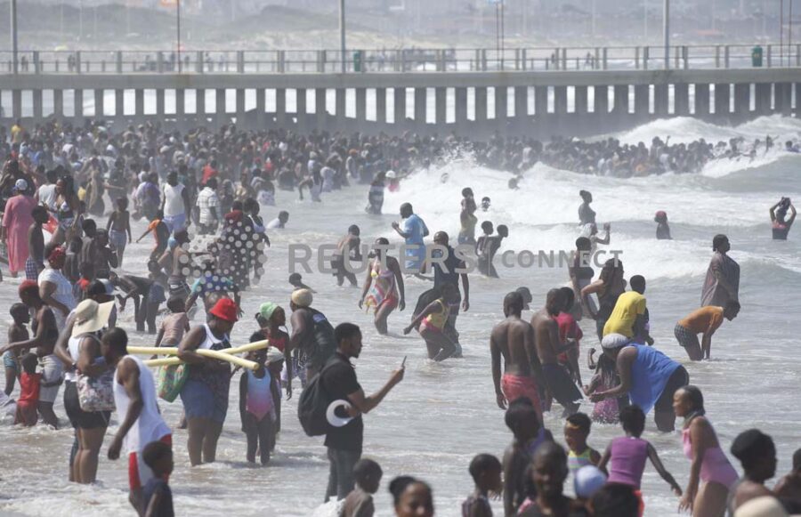 Revellers enjoy New Year's Day on a beach, in Durban