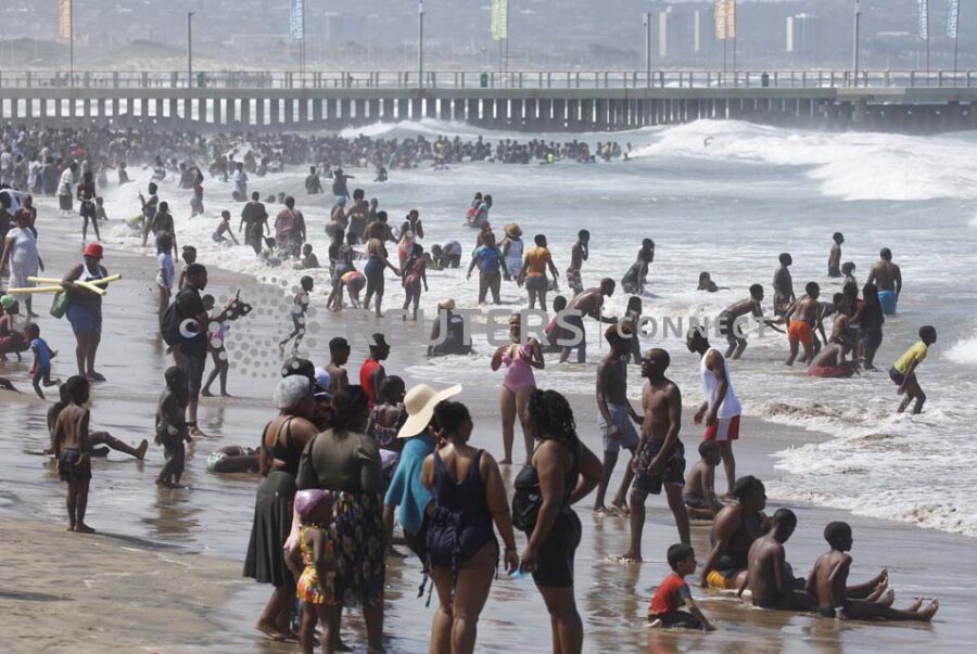 Revellers enjoy New Year's Day on a beach, in Durban