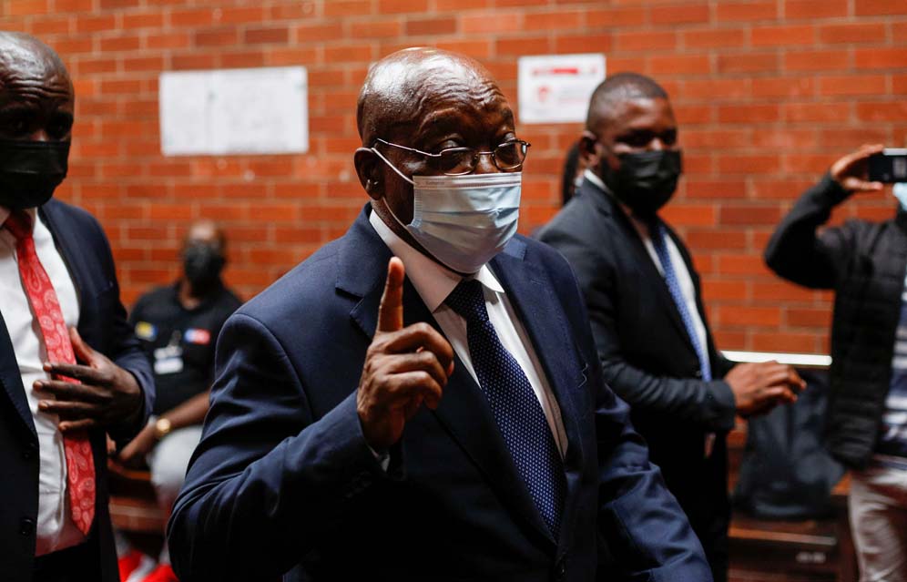 Former South African President Jacob Zuma speaks with members of the media before appearing at the High Court in Pietermaritzburg